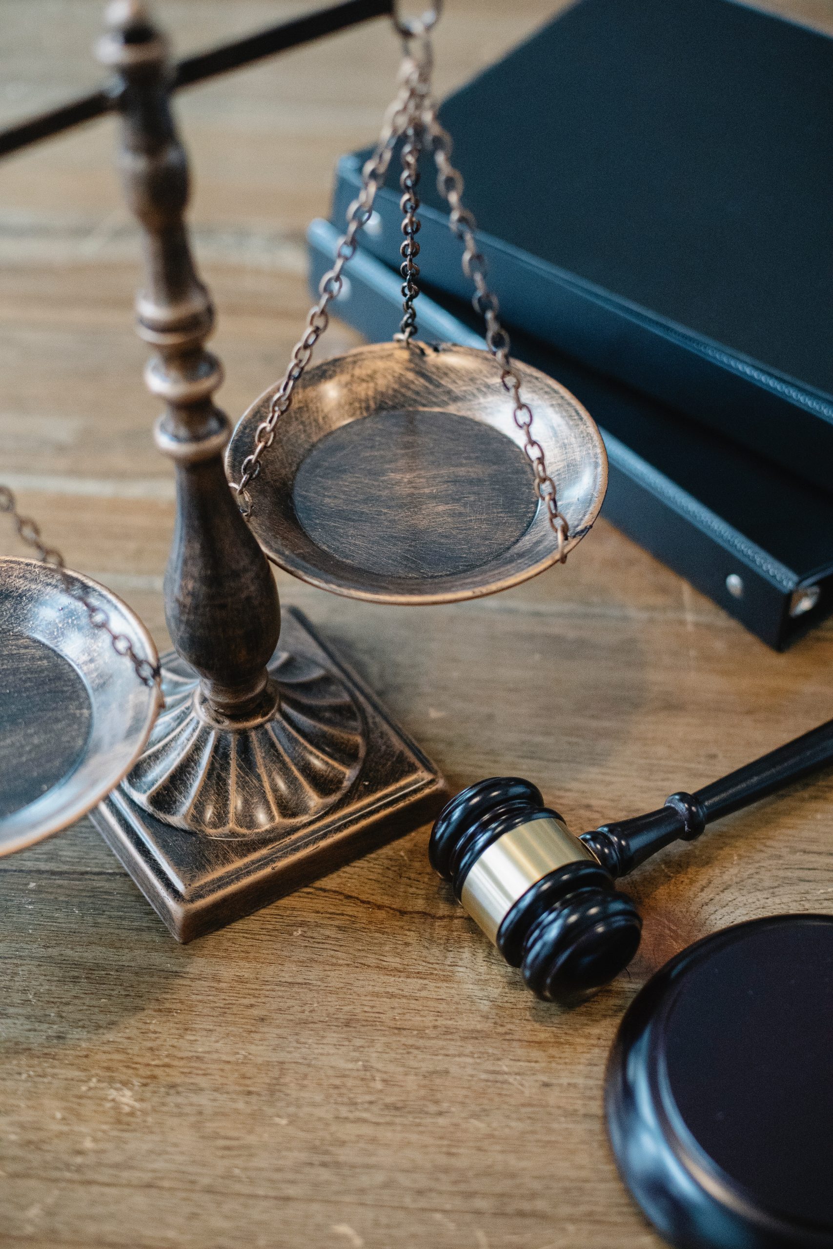 legal scales and gavel on a desk in daylight